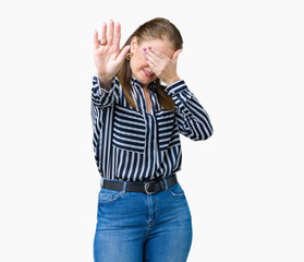 Middle age mature business woman over isolated background covering eyes with hands and doing stop gesture with sad and fear expression. Embarrassed and negative concept.