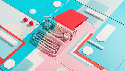 Typing machine in colorful composition.