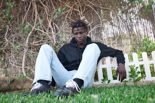 Young black man lying on the grass