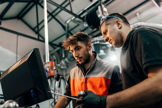 Mechanics working in the motorbike workshop