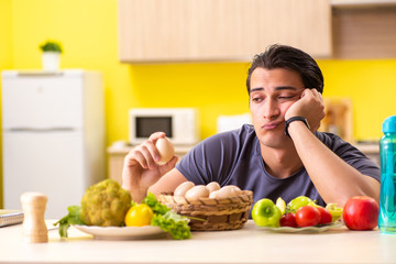 Young man in dieting and healthy eating concept