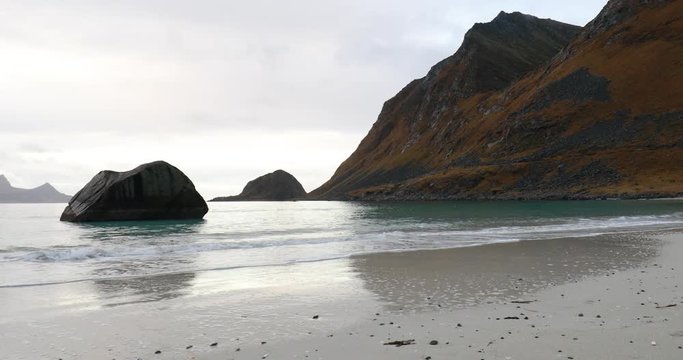 water splashing at Haukland beach, Lofoten, Norway in late fall