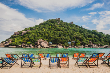 colorful beach chairs on the white sand beach at koh Nang Yuan in Suratthani province Thailand