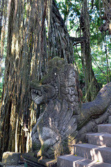 Stone Dragon Guarding the Bridge at the Sacred Monkey Forest Sanctuary and Temple in Ubud, Bali, Indonesia