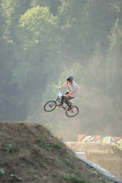 Male teenager with helmet perfroming extreme midair stunts with 