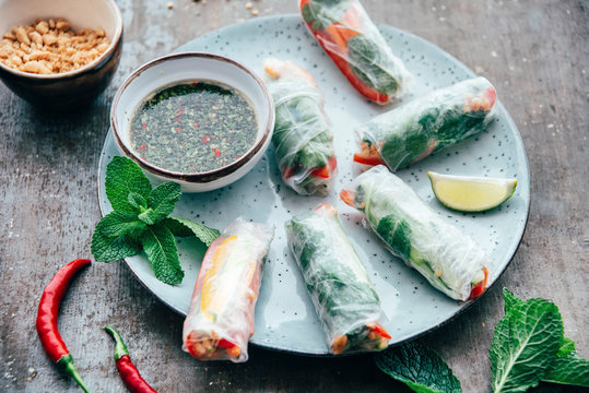 Food: Vietnamese summer roll with vegetables and sauce, vegan
