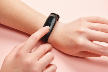 fitness bracelet on girl's hand