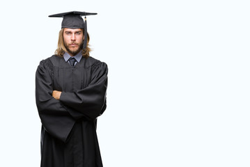 Young handsome graduated man with long hair over isolated background skeptic and nervous,...
