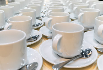 Group of empty coffee cups.
Many rows of white cup for service tea or coffee in breakfast at buffet event. 
Many rows of pure white cup.