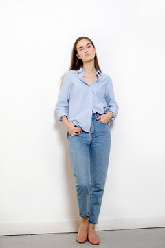 Young pretty woman against white background