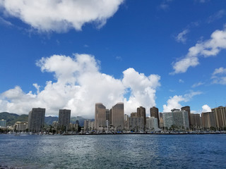 Fototapeta premium Skyline of Waikiki and Diamond Head during day with yachts and boats in Ala Moana harbor