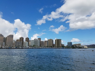Skyline of Waikiki and Diamond Head during day with yachts and boats in Ala Moana harbor
