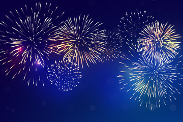 brightly colorful fireworks with pale smoke from fire on twilight background