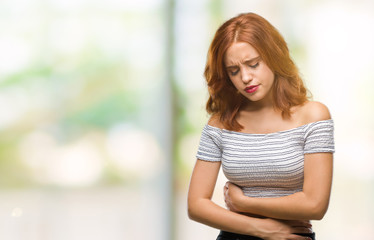 Young beautiful woman over isolated background with hand on stomach because nausea, painful disease...