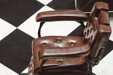 vintage barber leather chair in top viewwith Checkered background pattern 