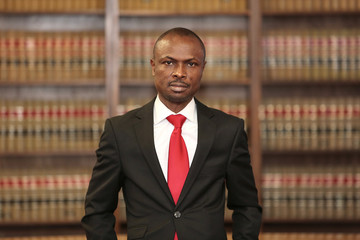 Portrait of a dynamic African American male model. Portrait of an attorney in a law office.