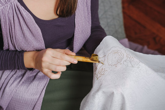 Female Artist Doing Batik Technique On The Piece Of Cloth