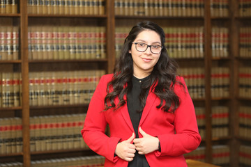 Young attractive professional woman, woman in law library,/