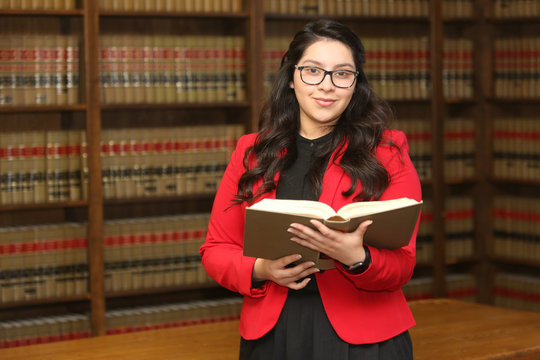 Young attractive professional woman, woman in law library,/
