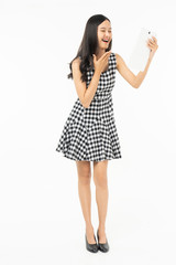 smiling beautiful  asian woman holding tablet computer isolated on a white background.