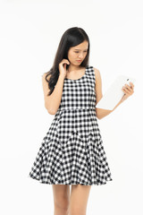 smiling beautiful  asian woman holding tablet computer isolated on a white background.