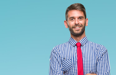 Young handsome business man over isolated background happy face smiling with crossed arms looking at the camera. Positive person.