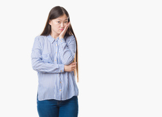 Young Chinese woman over isolated background thinking looking tired and bored with depression problems with crossed arms.