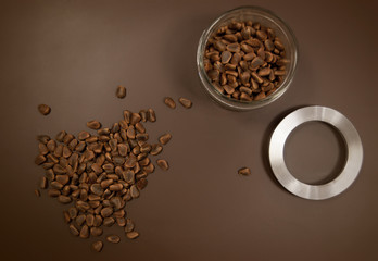 Crude pine nuts on brown background top view. Organic and healthy food.