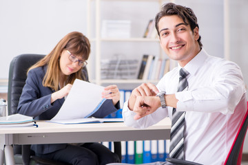 Man and woman discussing in office