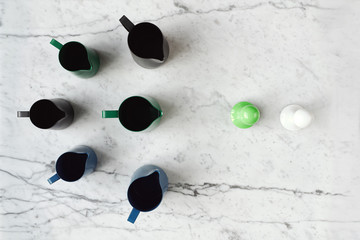 Composition with milk frothing jugs