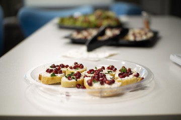 Pomegranate toast appetizers at holiday party