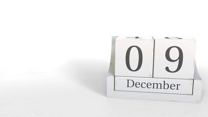 Cube calendar shows December 9 date. 3D animation