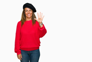 Obraz na płótnie Canvas Middle age adult woman wearing fashion beret over isolated background showing and pointing up with fingers number five while smiling confident and happy.