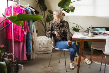Clothing designer in her industrial studio working.