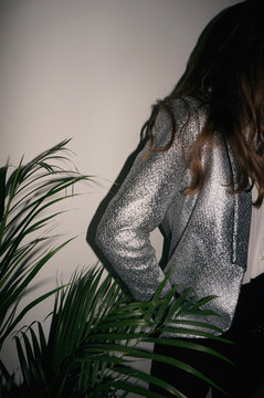 Young woman wearing glitter suit