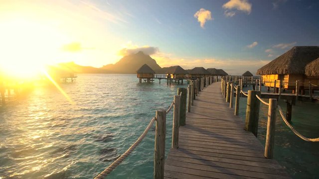 Bora Bora Mt Otemanu in French Polynesia a view of an Overwater Bungalow at sunset luxury tropical hotel resort in the South Pacific