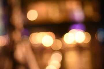 Abstract gold bokeh with black background. Christmas background. glitter lights background. defocused.