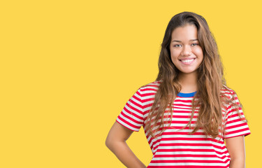 Obraz premium Young beautiful brunette woman wearing stripes t-shirt over isolated background with a happy and cool smile on face. Lucky person.