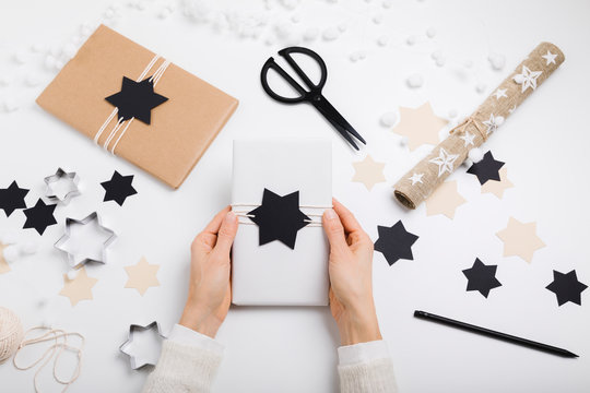 Female hands hold gift package