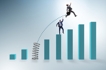 Businessman outperforming his competition jumping over