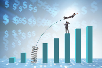 Businessman outperforming his competition jumping over