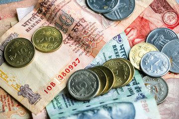 Closeup view of indian currency (banknotes and coins).