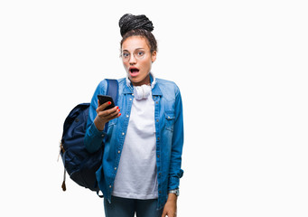 Young braided hair african american student girl using smartphone over isolated background scared in shock with a surprise face, afraid and excited with fear expression