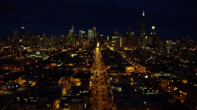 Aerial night view of Chicago city freeways and downtown skyscraper buildings