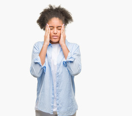 Young afro american woman over isolated background with hand on head for pain in head because stress. Suffering migraine.