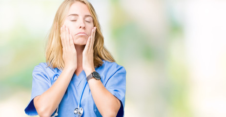 Beautiful young doctor woman wearing medical uniform over isolated background Tired hands covering face, depression and sadness, upset and irritated for problem