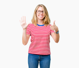 Fototapeta na wymiar Beautiful young woman wearing glasses over isolated background showing and pointing up with fingers number six while smiling confident and happy.