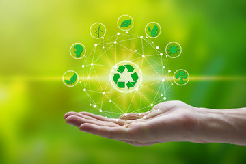 Hand holding with environment icons over the Network connection