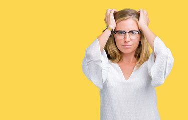 Beautiful young woman wearing glasses over isolated background suffering from headache desperate and stressed because pain and migraine. Hands on head.