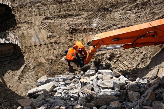 New York City, New York, USA: Workmen Examining Machinery Used For Breaking Up Manhattan Schist Bedrock As Construction Begins On A New Building In Midtown Manhattan.